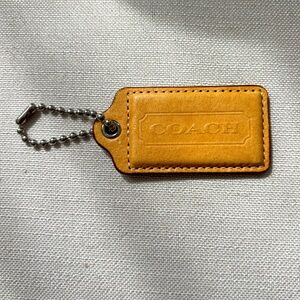 LOW START!🔥Coach Tan Leather Tag - Large!